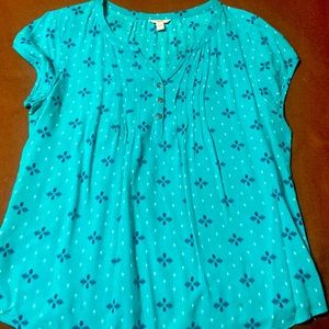 Teal blouse with blue and white accents